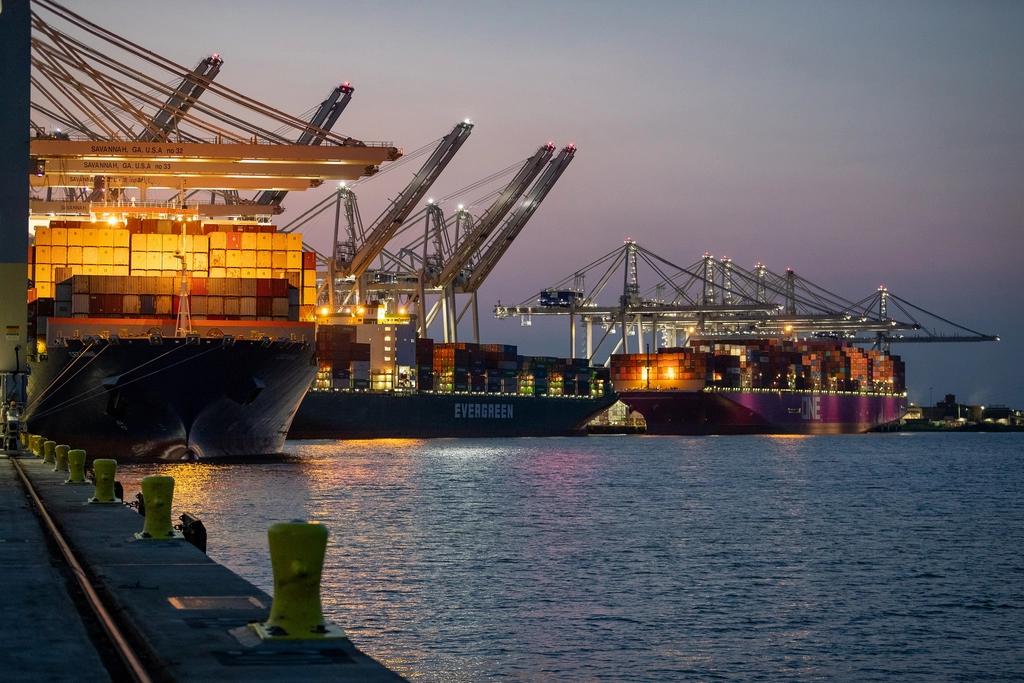 A container vessel alongside a terminal at dusk